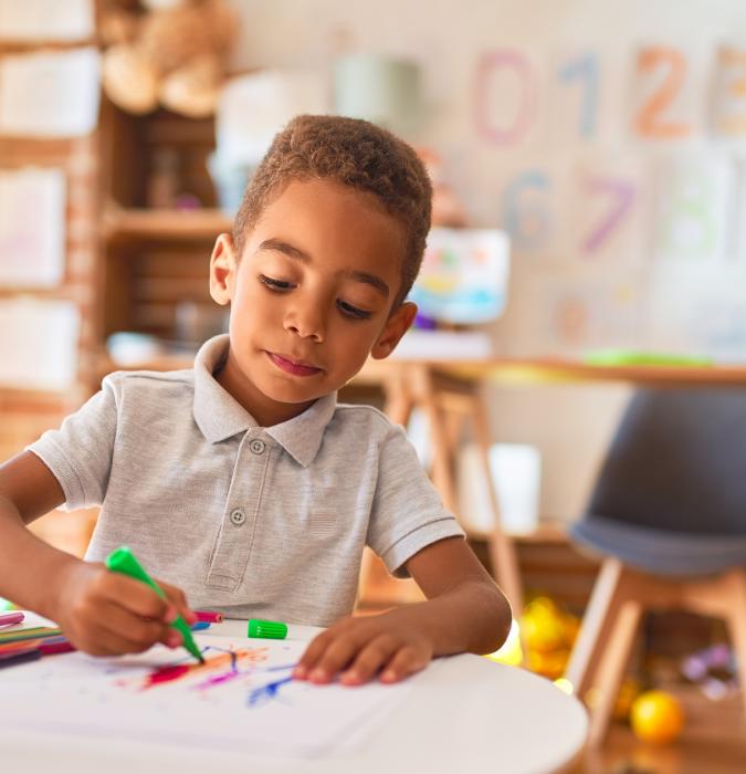 Child playing with blocks at table